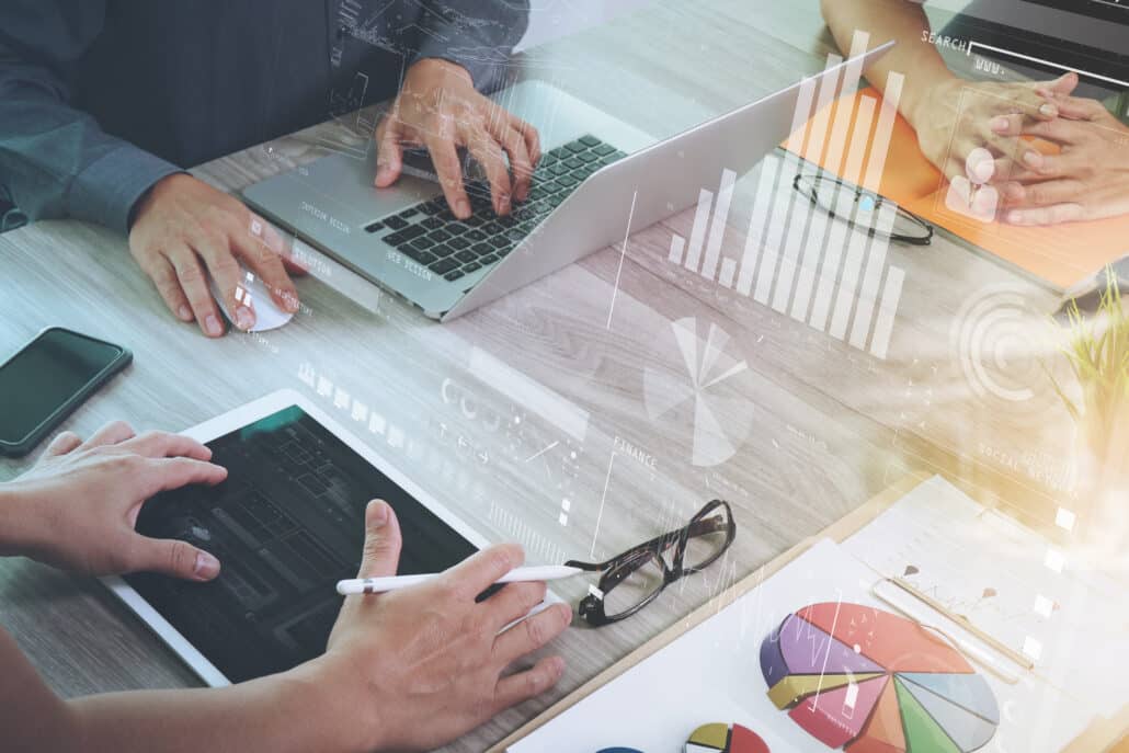 business documents on office table with smart phone and laptop c financial tools